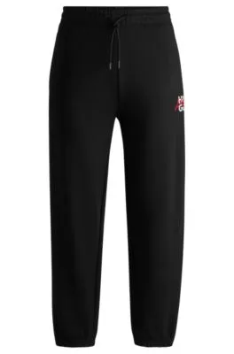 Cotton-terry tracksuit bottoms with double logo