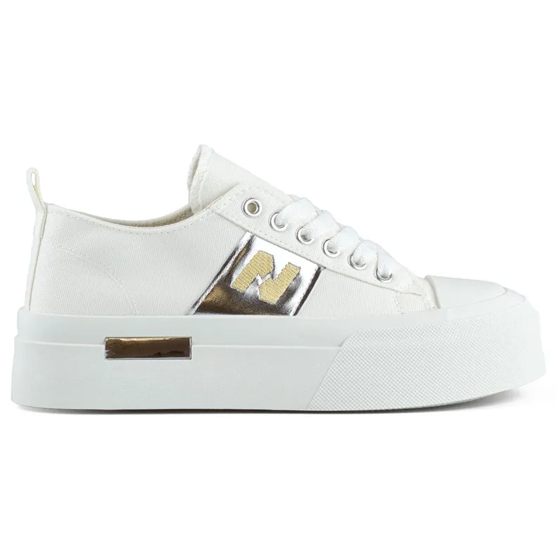 White fashionable women's sneakers with a thick platform sole