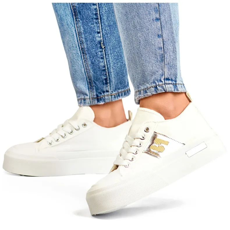 White fashionable women's sneakers with a thick platform sole